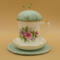 This is the pincushion bobbin holder sitting on top of the trivet, The view is from the front with the handle on the right.