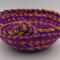 This is looking directly at the basket with the knot in front. The base is 6 inches. At 9.5 inches wide, the depth of 4 inches is ample.