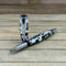 Capped rollerball pen with coffee beans in white resin 