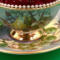 This shows details of the hand painting on the cup and saucer.
