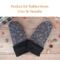 Pair of speckled black and white thumbless baby mittens with text ‘Perfect for Babies from 0 to 36 Months’; soft fleece winter mittens.