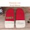 Pair of warm and cozy wool red baby mittens with knit beige ribbed cuffs; thumbless winter mittens for babies and toddlers.