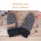 Pair of warm & cozy speckled black and white fleece baby mittens with black ribbed cuffs; thumbless winter mittens for toddlers.