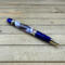 Blue and gold DnD ballpoint pen with DnD Postage Stamps 