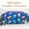 Back of handmade axolotl print belt bag—lightweight washable cotton with colorful aquatic pattern and adjustable strap.