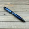 navy blue and gray resin ballpoint pen with gunmetal hardware