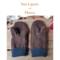Women’s handmade brown fleece mittens with navy cuffs shown on rustic wood background under text “Two Layers of Fleece.”