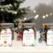 Set of three handmade Hot Cocoa Jars—Fall, Christmas, and Winter editions—displayed together on snowy surface