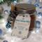 Winter Cocoa Jar on snow background with pine branches and glowing white lights for a festive look