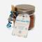 Winter Hot Cocoa Jar with blue ribbon, wooden spoon, and snowflake tag displayed on white background.