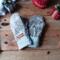 A cozy pair of teen, small woman’s handmade mittens crafted from fluffy gray fleece with silver gray ribbed cuffs; handmade and winter ready