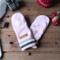 A cozy pair of teen, small woman’s handmade mittens crafted from soft pink argyle pattern fleece with ribbed cuffs; handmade & winter ready.