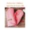 A pair of handmade kids ages 8 to 10 sized mittens made from a soft upcycled coral pink Eddie Bauer fleece jacket, with a faux leather tag.