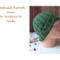 Side view of the hat's ribbed pattern shows the green acrylic yarn, & the artisan texture. A comfortable, stretchy fit for adults and teens.
