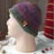 A hand knit acrylic & wool beanie in ombre red & blue. A winter holiday gift for children and preteens ages 10, 11, 12, 13, 14.