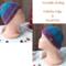 A side view of a handmade baby hat in a blue & purple wool blend yarn. Great for winter holiday gifting for newborn babies 0 to 12 months.