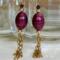 Ruby red earrings with golden cascading chain. Durable 14K gold filled metal components
