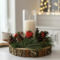 Farmhouse wood slice candle centerpiece with faux pine, pinecones, red hearts, and ivory pillar candle
