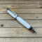 Chrome rollerball pen with white acrylic body
