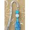 Lovely, stunning, beautiful, and one of a kind.  Kokopelli is a Native American deity and a flutist. We found a bead which lends itself to Southwestern design with its makings. We added white and turquoise sparkle beads effect. A kokopelli charm is at bottom and and the shepherd hook has additional markings to complete this item.