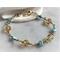 Wire wrap bracelet topaz and aqua beads