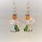 Green and silver skirt closeup of little angel earrings with crystal wings
