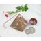 Tiny Copper Enamel bowl used as a Bud Vase on Gemstone Base with copper wire to support a tiny flower stem shown with time and quarter for size reference