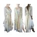 A white, cream and tan long wedding dress. Features lots of crochet on the front with fringe and a lace up back. Beautiful gown. Lots of lace and soft fabrics in the tattered skirt. One of a kind, hand made, eco-friendly bohemian style dress.