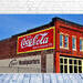 A classic site in downtown Knoxville, this brightly colored, painted brick building says &quot;Drink Coca-Cola - Made in Knoxville 5 cents&quot; and &quot;Carpet Headquarters&quot; Fine Art Print by K Emlen Photography