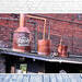Photograph of Ole Smoky Tennessee Moonshine still on a the roof of an abandoned brick building in downtown Knoxville, Tennessee. Fine art decor by K Emlen Photography