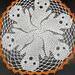round doily with six ghosts and orange border