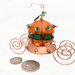 miniature pumpkin carriage made of copper enamel and copper wire showing size related to dime and quarter