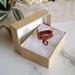 Copper wire wrapped three stone Labradorite Ring in packaging