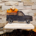 Halloween truck with Jack O Lanterns and skulls.