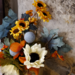 Floral arrangement with white sunflower and blue flocking ball