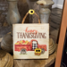 Happy Thanksgiving sign propped with other décor