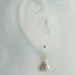 Petite silver heart and peridot dangle earrings