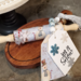 Let it Snow Tiered tray set rolling pin and tag garland