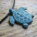 Copper sea turtle pendant on your choice of leather necklace. Black