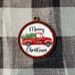 Red truck ornament with red and black check frame