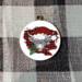 Highland Christmas Cow ornament on buffalo check background
