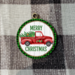 Red truck ornament with green and black check frame
