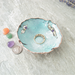 free form copper enamel trinket dish with opal and amethyst beads shown with coins and I Love You ring for size reference