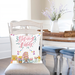 Spring vibes pillow on dining chair