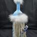Side view of Light Blue and Grey Lady Gnome Wine Bottle Decoration with Winter Accents