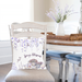 Wisteria pillow cover displayed on pillow in dining chair