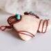 Conch Shell and Magnesite Red Copper and Aluminum Wire Wrapped Pendant