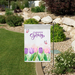 Welcome Spring tulip garden flag in a garden landscape