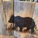 A handmade wood box made with upcycled fencing. Box as a picture of black bear wood-burned on to it.