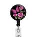 Butterfly and pink roses on a black background affixed to a retractable badge reel.